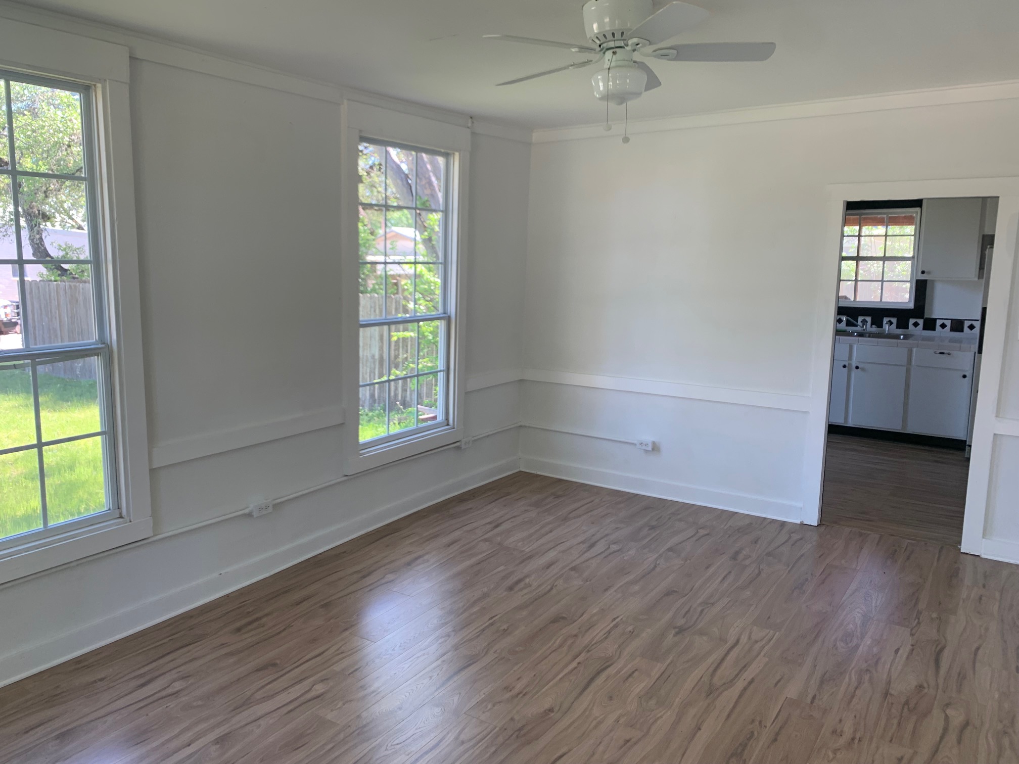 435 North Street Bertram, TX 78605 - Photo 5 of 14 wooden floor in an empty room with a window