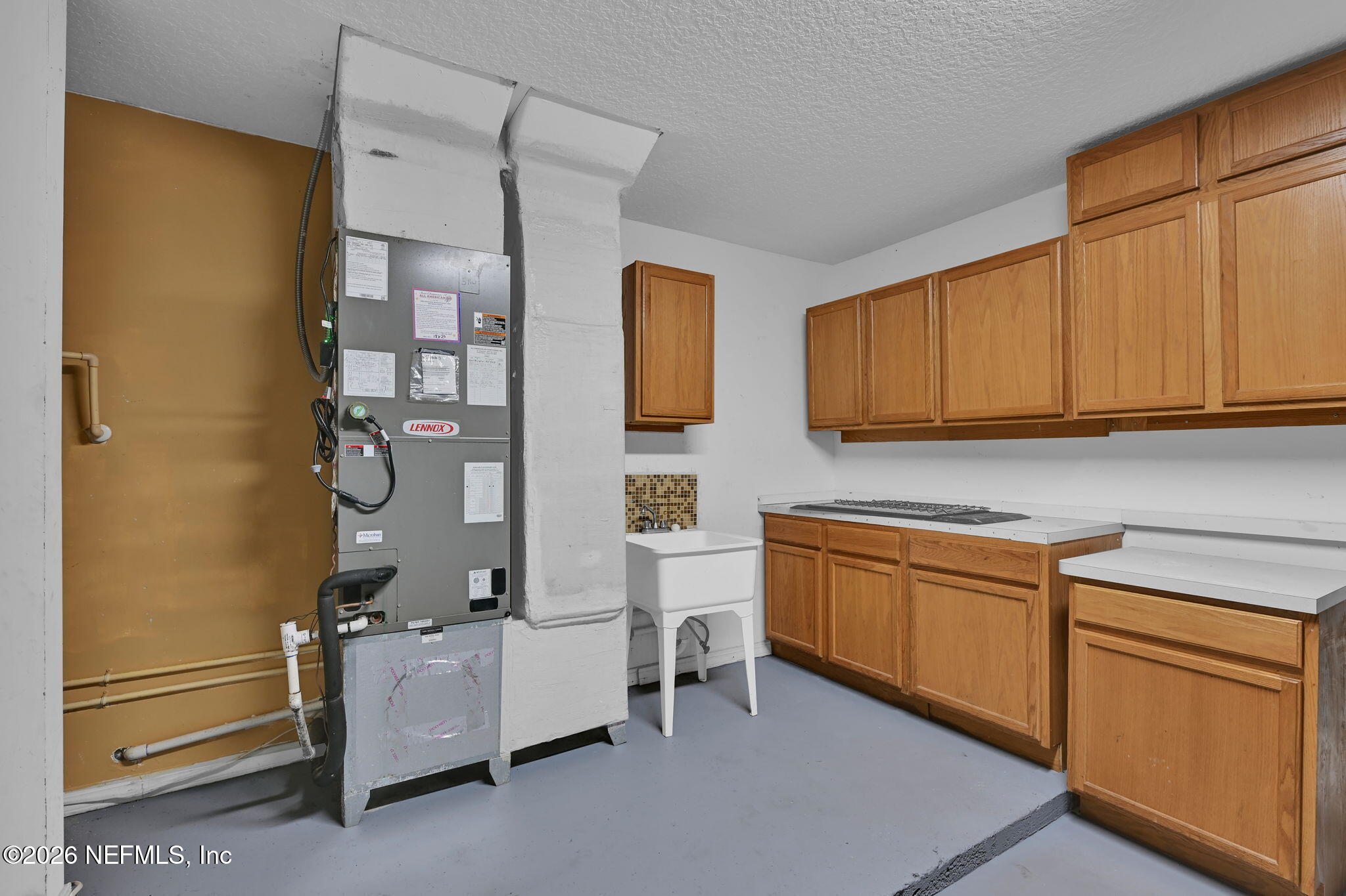 1110 Woodlawn Road, Unit D St. Augustine, FL 32084 - Photo 34 of 40 a kitchen with stainless steel appliances granite countertop a sink stove and refrigerator
