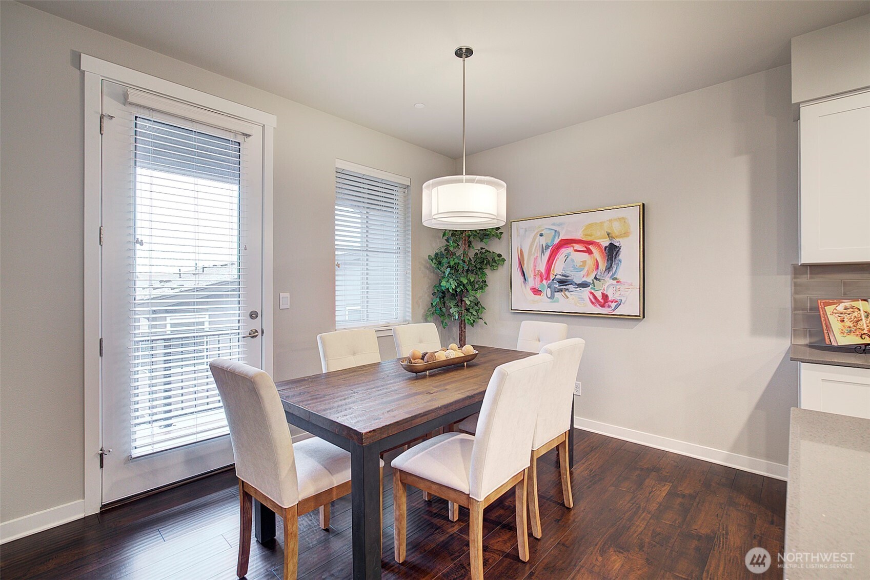 1325 Seattle Hill Road, Unit L2 Bothell, WA 98012 - Photo 18 of 36 a view of a dining room with furniture wooden floor and chandelier