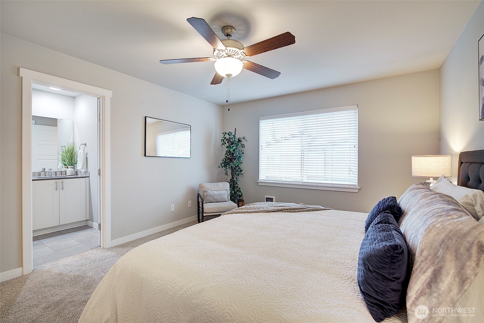 1325 Seattle Hill Road, Unit L2 Bothell, WA 98012 - Photo 23 of 36 a bedroom with a large bed and a window