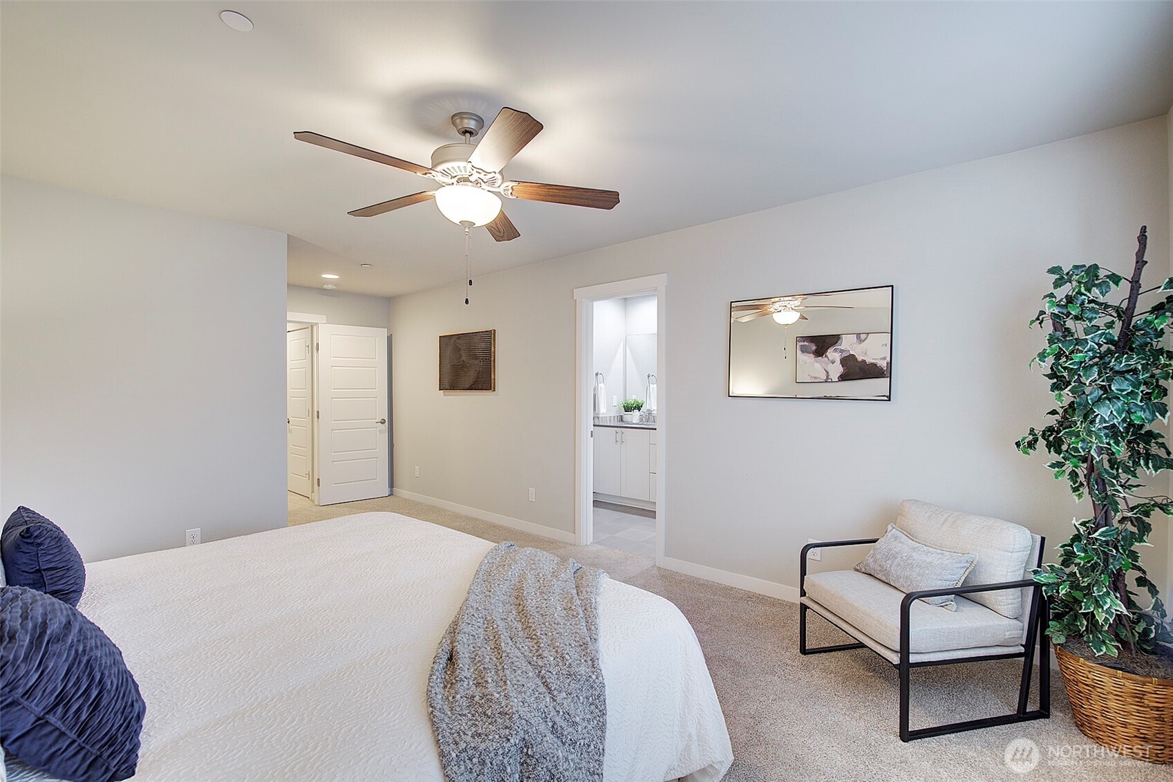 1325 Seattle Hill Road, Unit L2 Bothell, WA 98012 - Photo 24 of 36 a bedroom with a bed and a chandelier