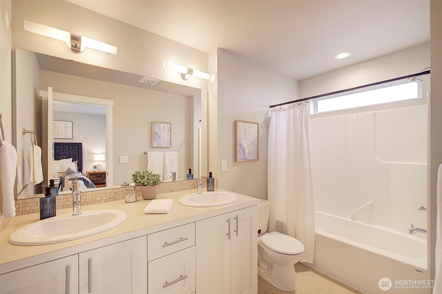 1325 Seattle Hill Road, Unit L2 Bothell, WA 98012 - Photo 31 of 36 a bathroom with a double vanity sink toilet mirror and shower
