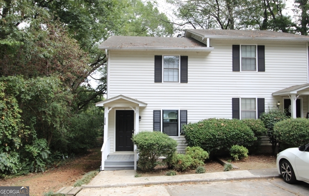 322 A & B And 3 Alfred Avenue Southeast, Unit 322 Rome, GA 30161 - Photo 3 of 9 a front view of a house with a garden