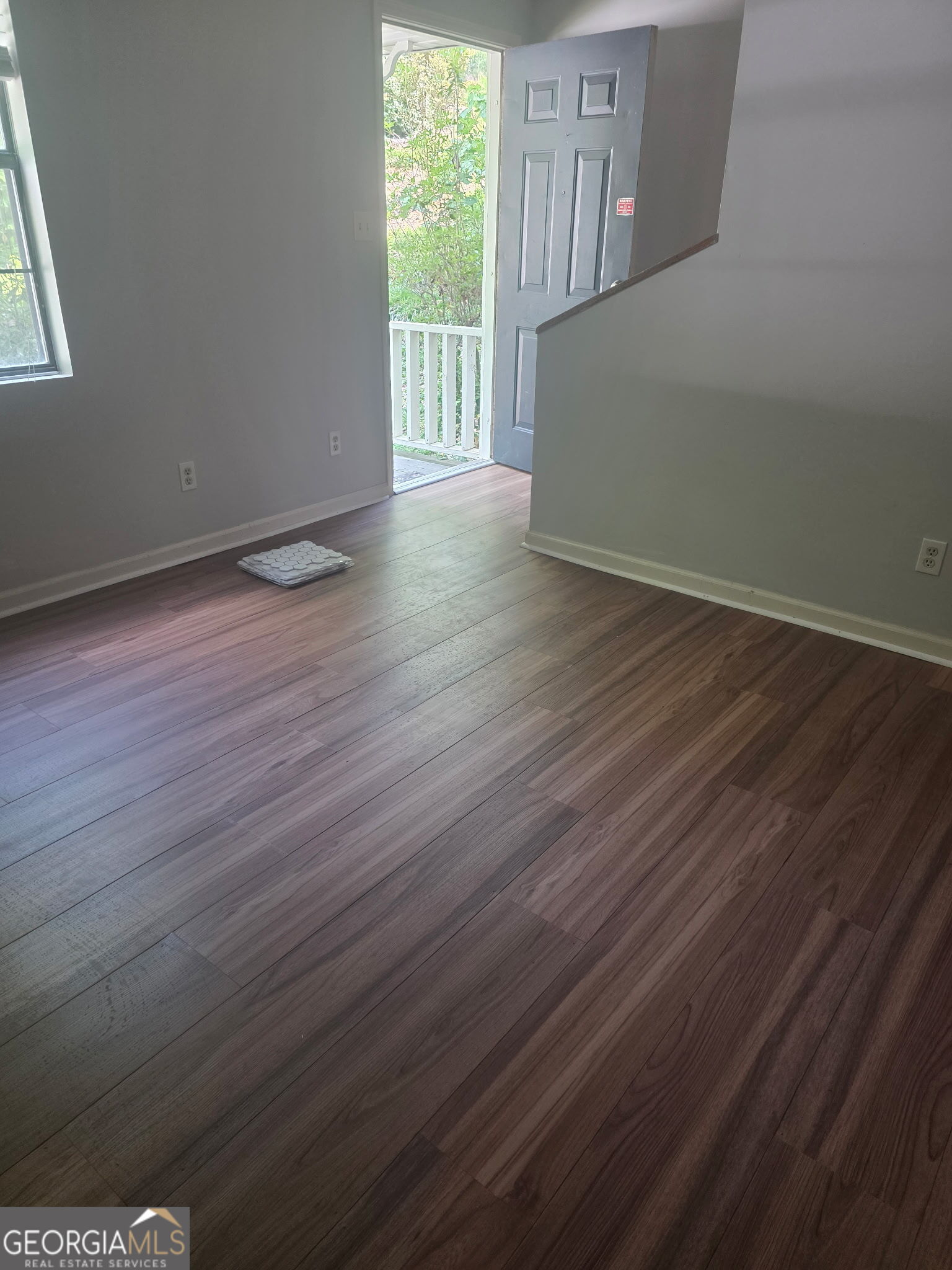 322 A & B And 3 Alfred Avenue Southeast, Unit 322 Rome, GA 30161 - Photo 5 of 9 a view of an empty room with wooden floor and a window