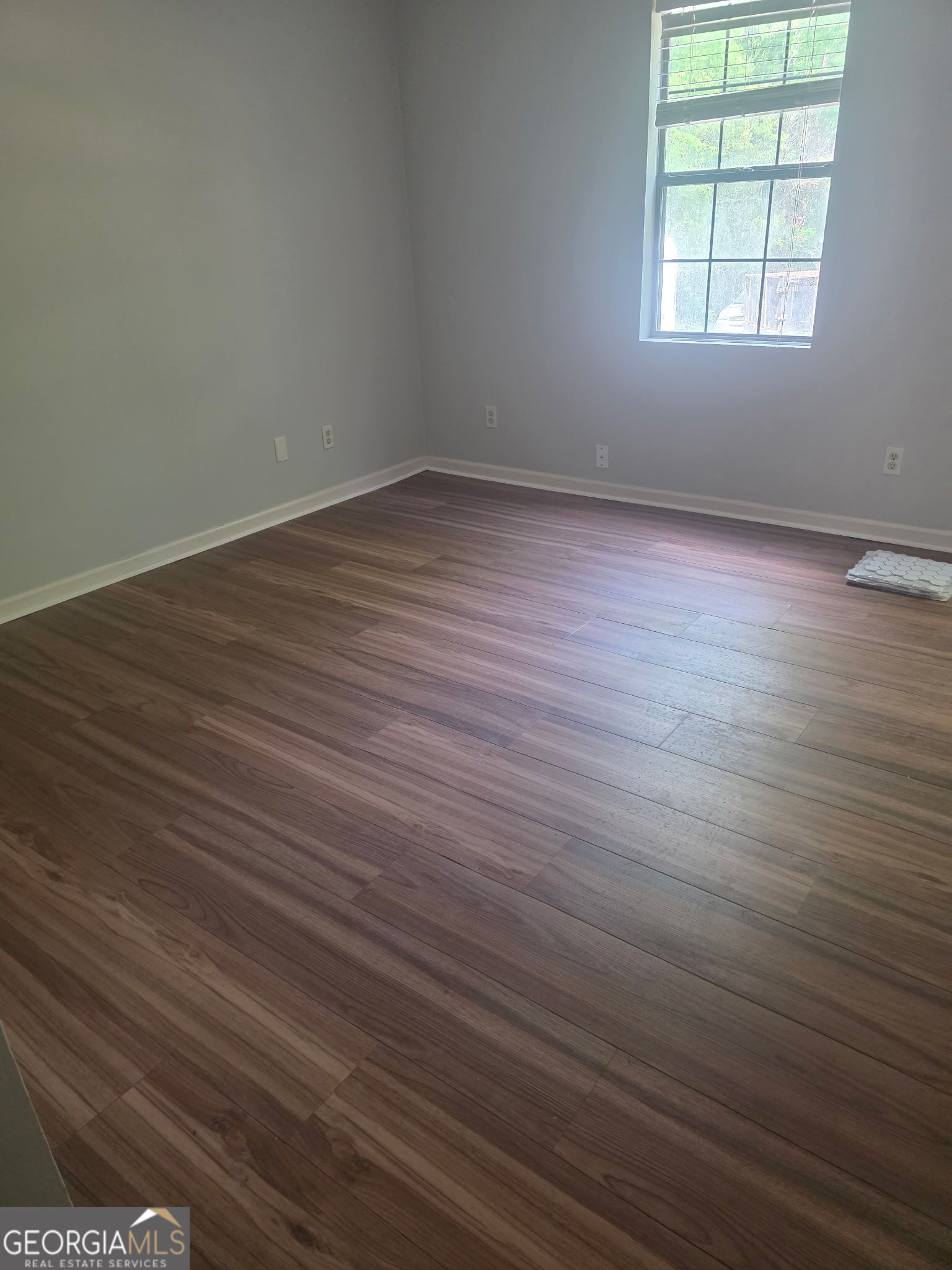 322 A & B And 3 Alfred Avenue Southeast, Unit 322 Rome, GA 30161 - Photo 6 of 9 an empty room with wooden floor and windows