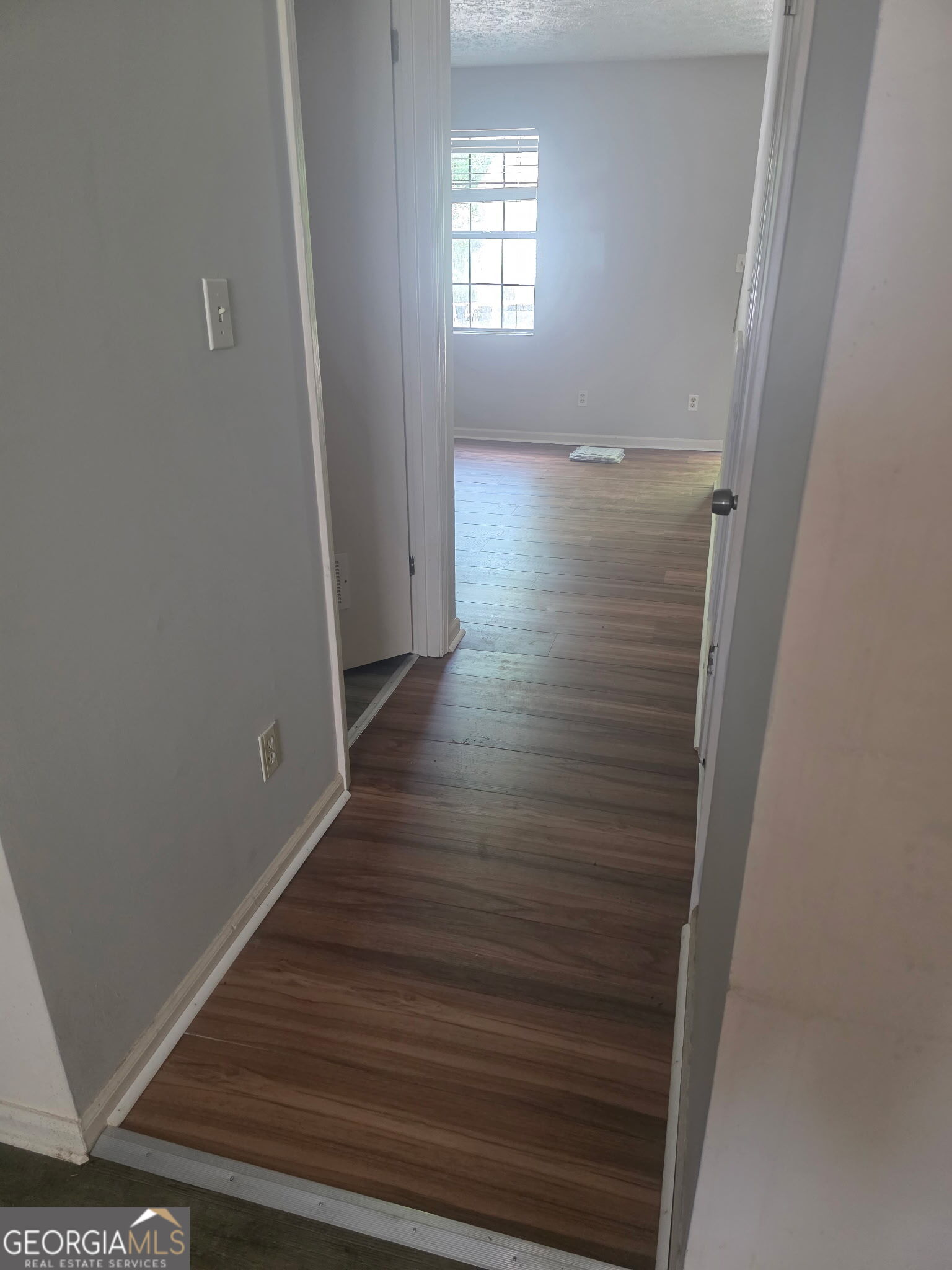 322 A & B And 3 Alfred Avenue Southeast, Unit 322 Rome, GA 30161 - Photo 7 of 9 an empty room with wooden floor and windows