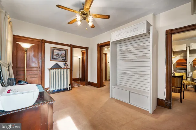 a view of a livingroom with furniture and a window