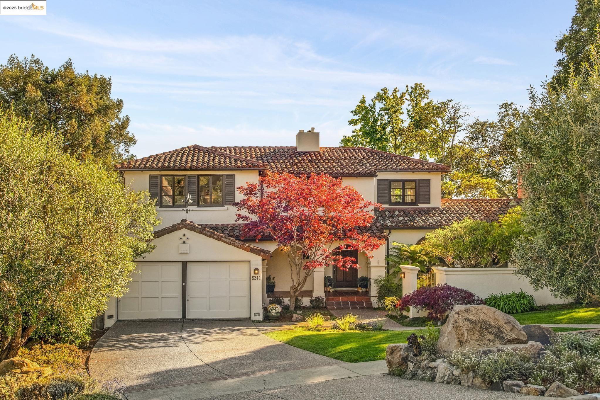 5311 Golden Gate Avenue Oakland, CA 94618 - Photo 1 of 1 a front view of a house with a yard and garage
