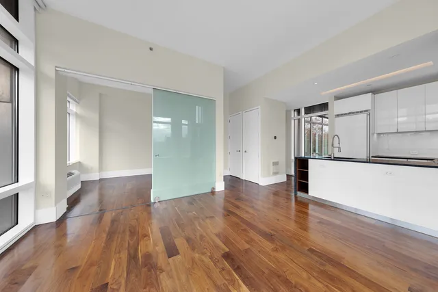 a kitchen with granite countertop a stove and a refrigerator