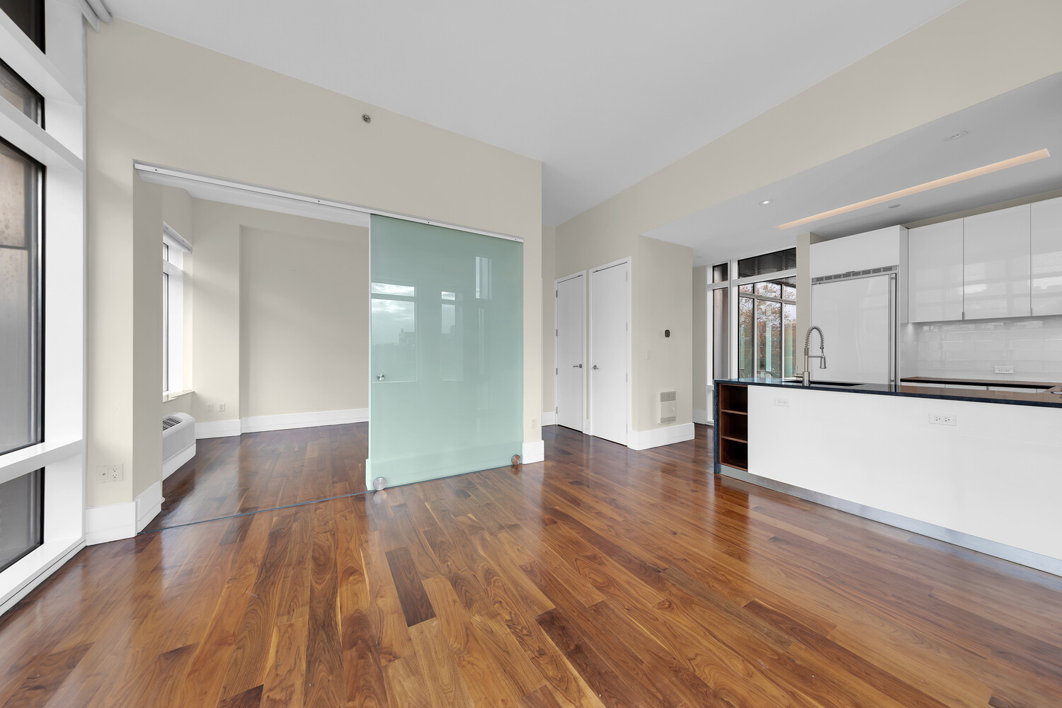 10-17 Jackson Avenue, Unit 2C Queens, NY 11101 - Photo 3 of 6 a view of empty room with wooden floor