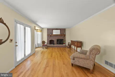 a view of an empty room with a fireplace