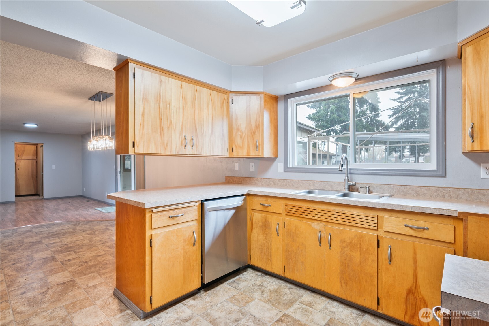 2128 44th Avenue Longview, WA 98632 - Photo 12 of 35 a kitchen with a sink stove and cabinets
