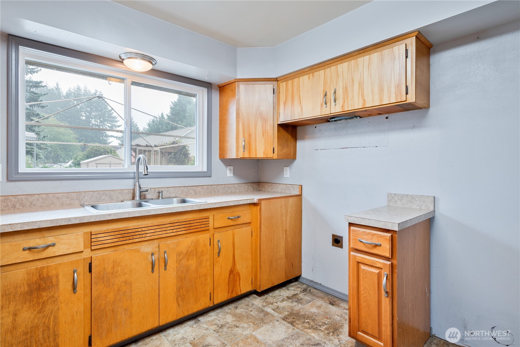2128 44th Avenue Longview, WA 98632 - Photo 13 of 35 a kitchen with stainless steel appliances granite countertop a sink a stove and cabinets
