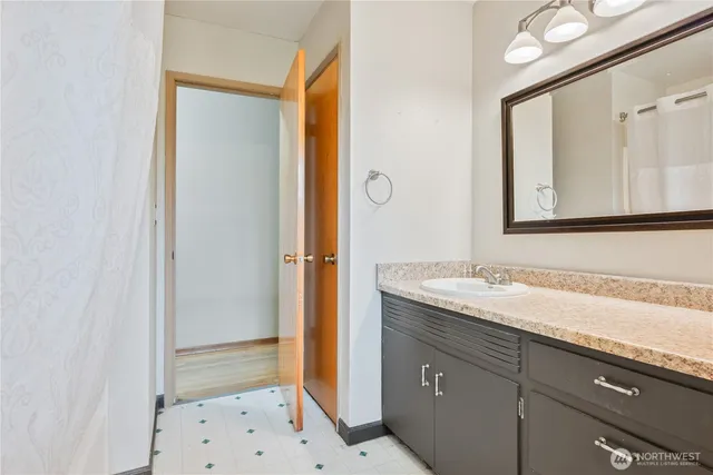 a bathroom with a sink and a mirror