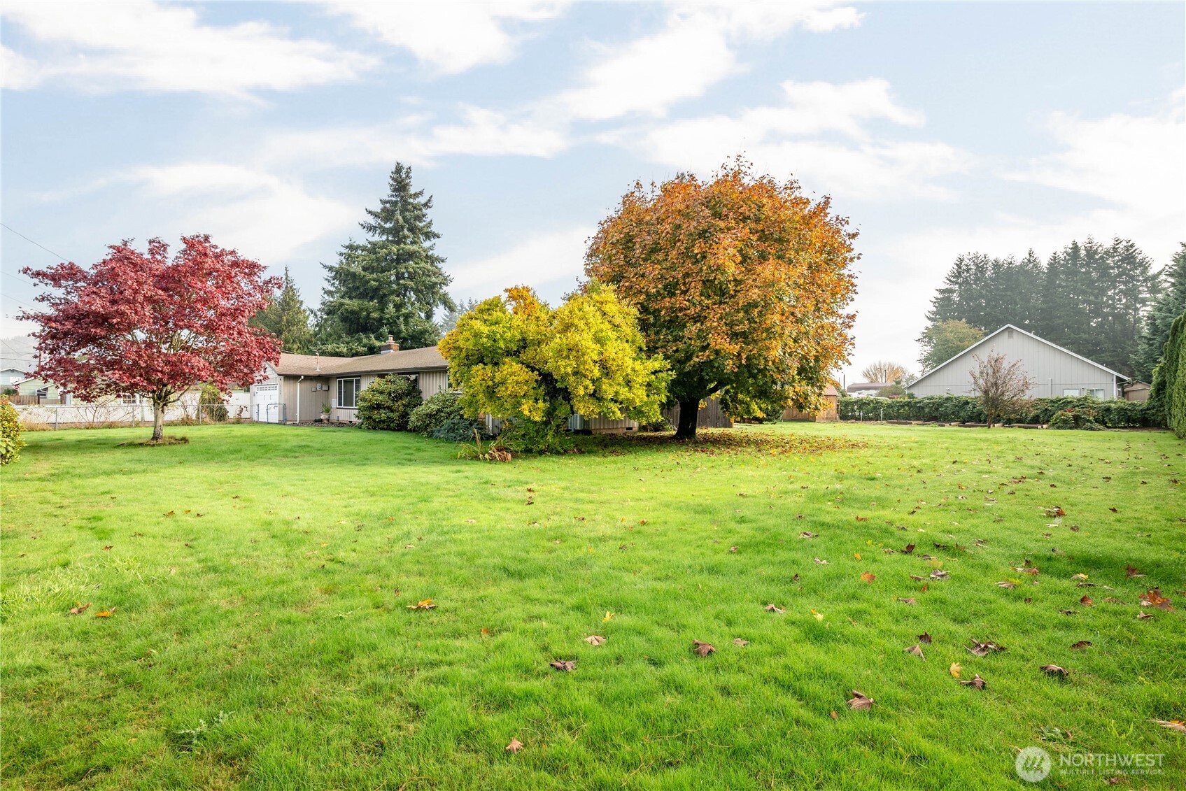 2128 44th Avenue Longview, WA 98632 - Photo 26 of 35 a backyard of a house with lots of green space