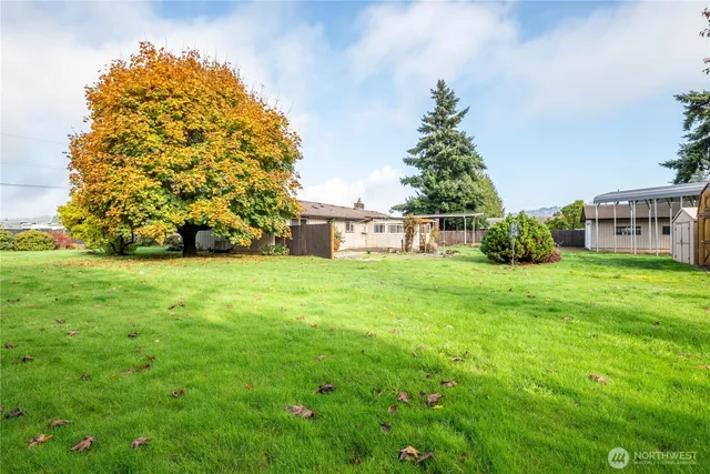 a view of a garden with a house