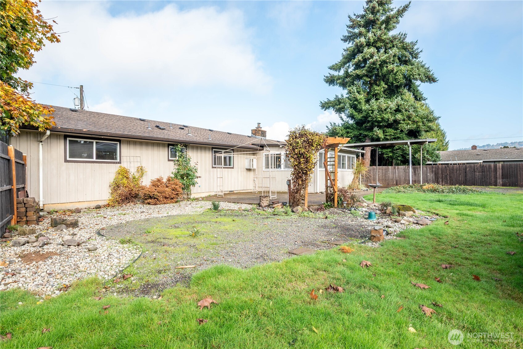 2128 44th Avenue Longview, WA 98632 - Photo 29 of 35 a view of a house with yard and a garden