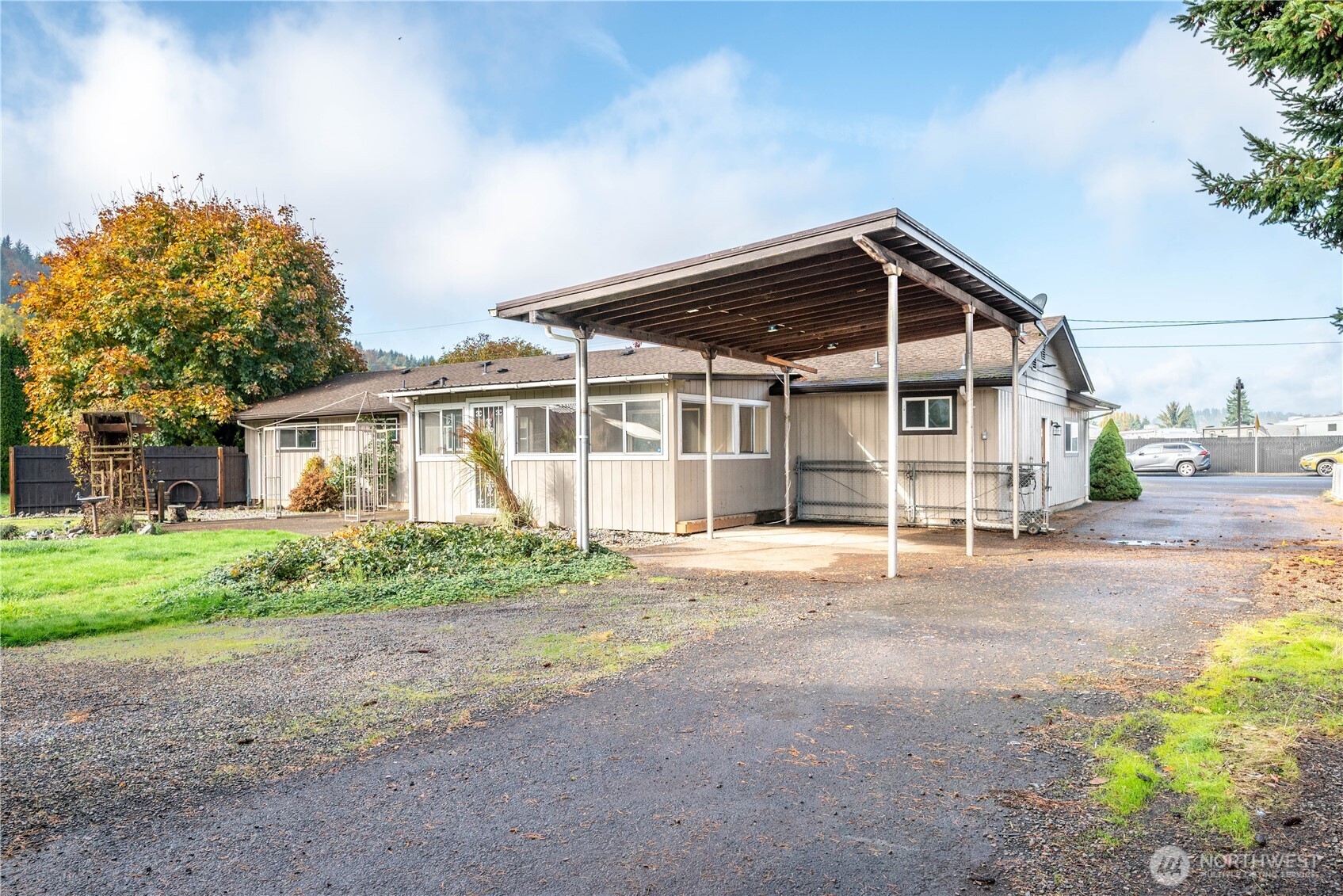 2128 44th Avenue Longview, WA 98632 - Photo 33 of 35 a front view of a house with a garden and trees