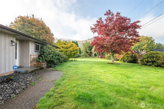 a backyard of a house with lots of green space