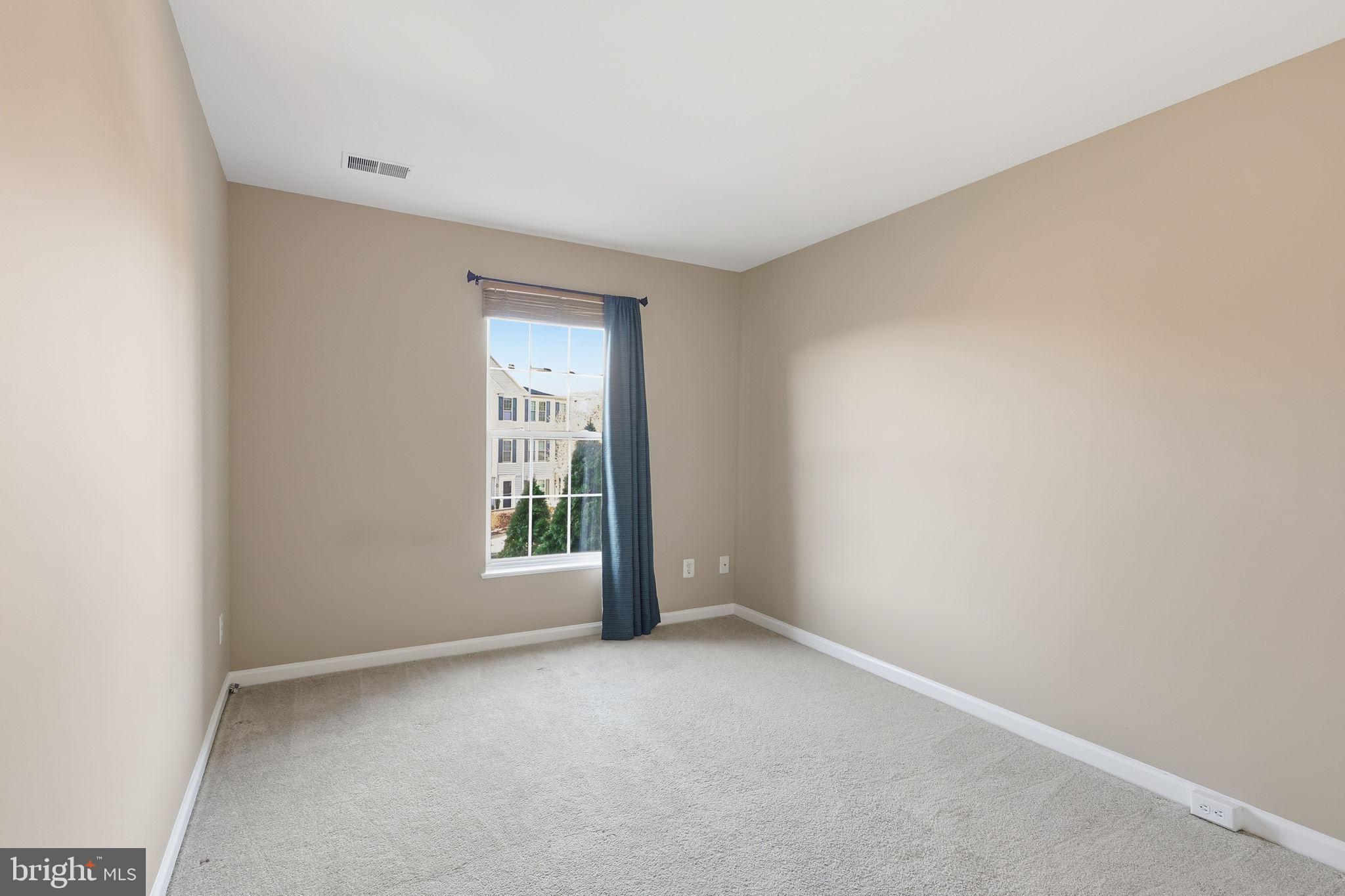 9304 Witch Hazel Way Manassas, VA 20110 - Photo 29 of 45 a view of an empty room with a window