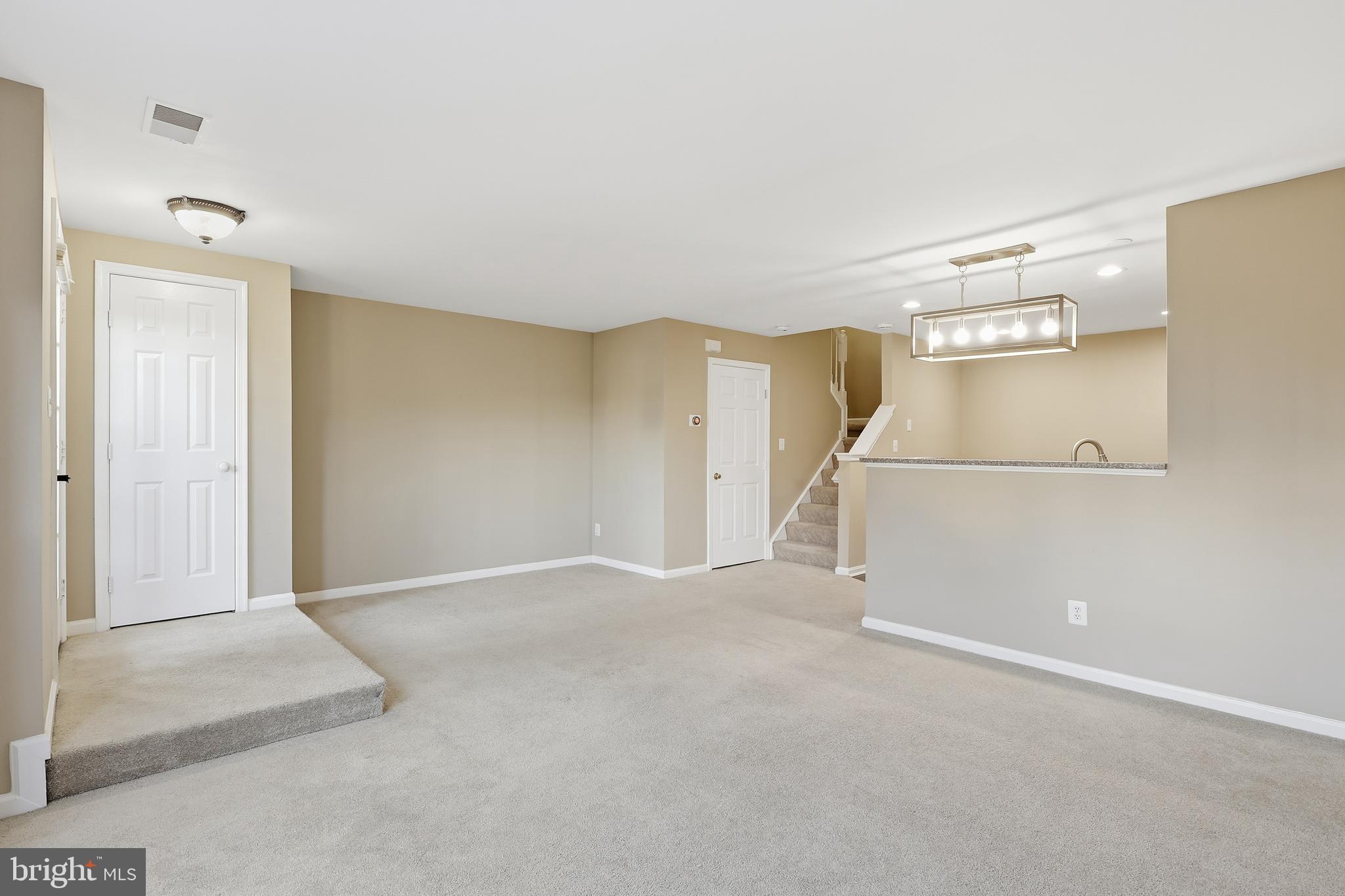 9304 Witch Hazel Way Manassas, VA 20110 - Photo 3 of 45 an empty room with windows and entrance