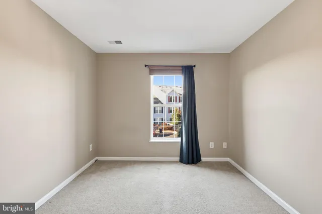 a view of an empty room and window