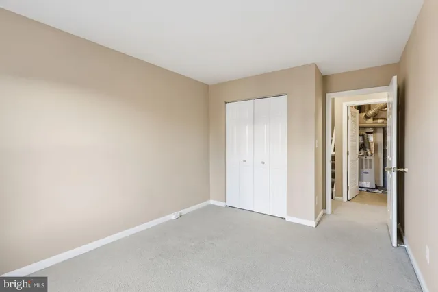 a view of an empty room and closet