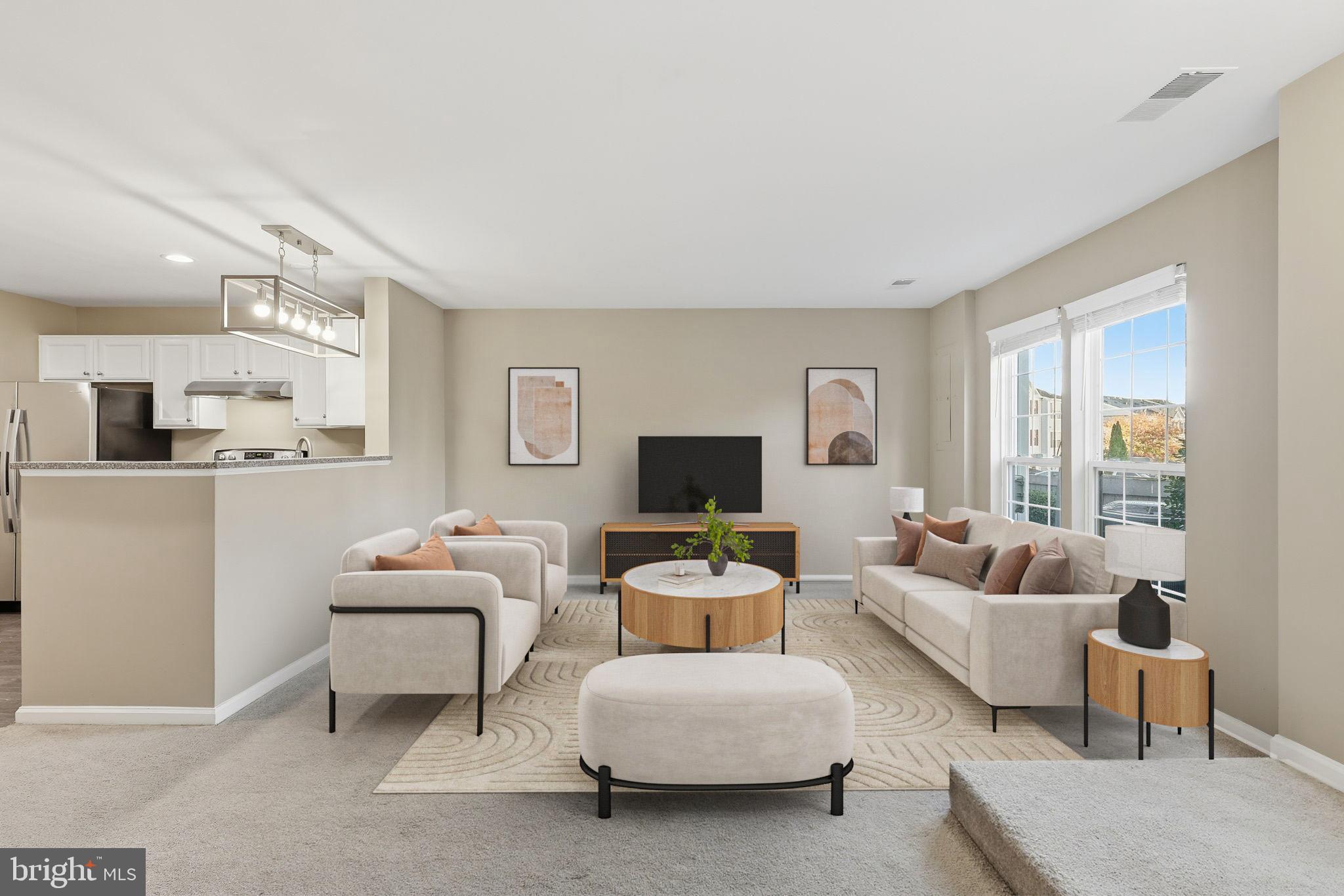 9304 Witch Hazel Way Manassas, VA 20110 - Photo 4 of 45 a living room with furniture and a flat screen tv