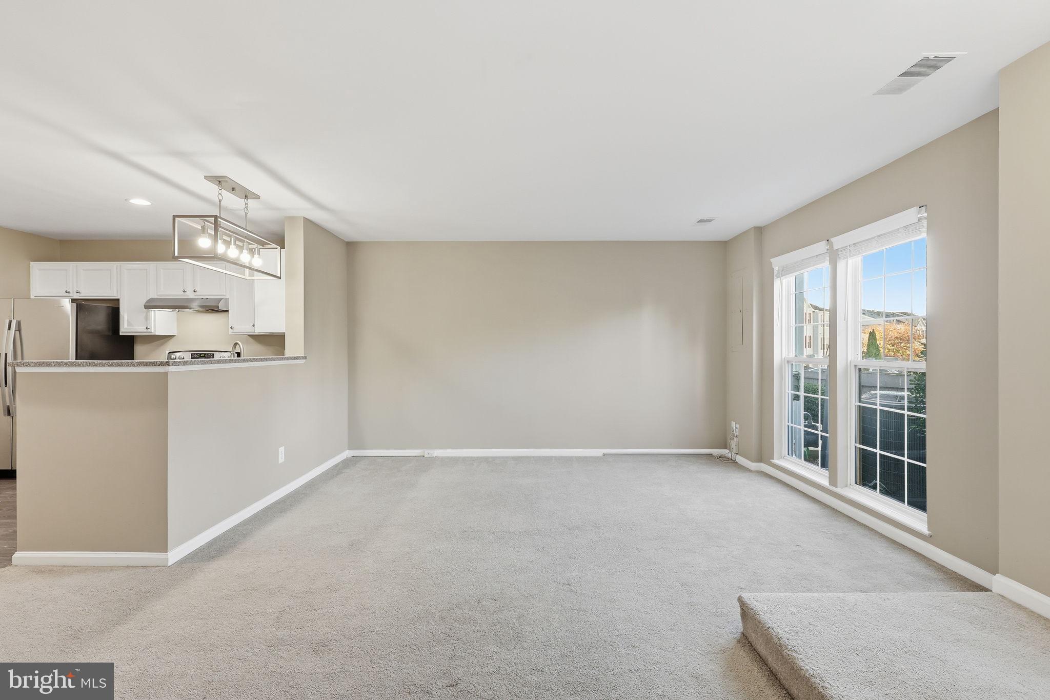 9304 Witch Hazel Way Manassas, VA 20110 - Photo 5 of 45 a view of a kitchen with refrigerator and windows