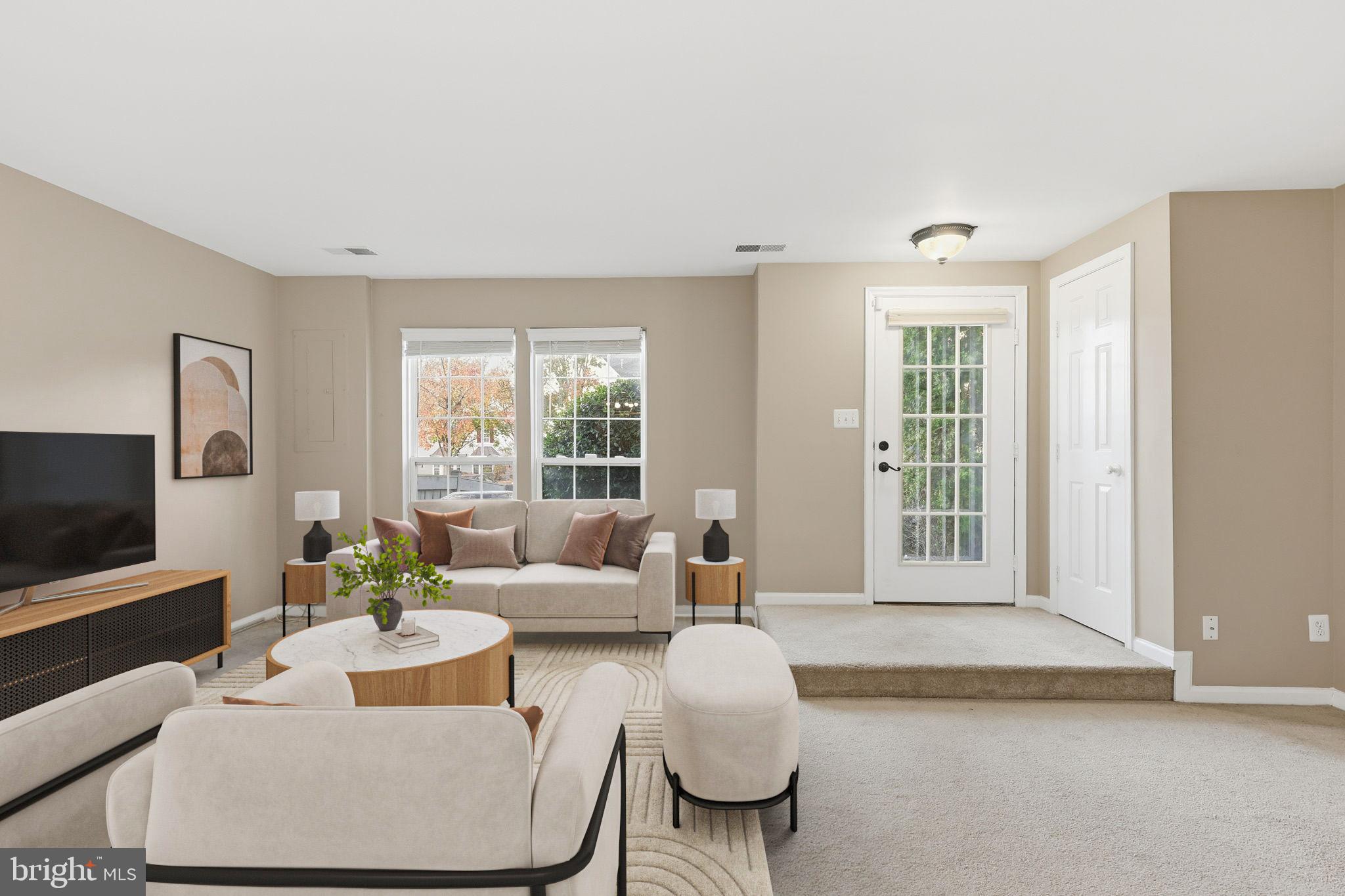 9304 Witch Hazel Way Manassas, VA 20110 - Photo 6 of 45 a living room with furniture and a flat screen tv