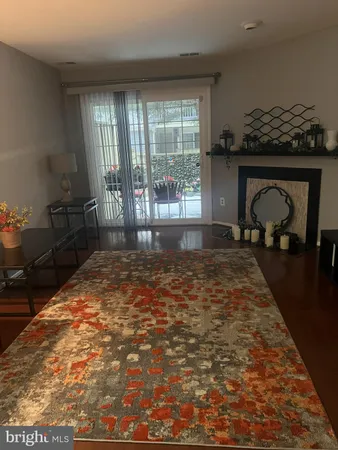 a view of empty room with a fireplace