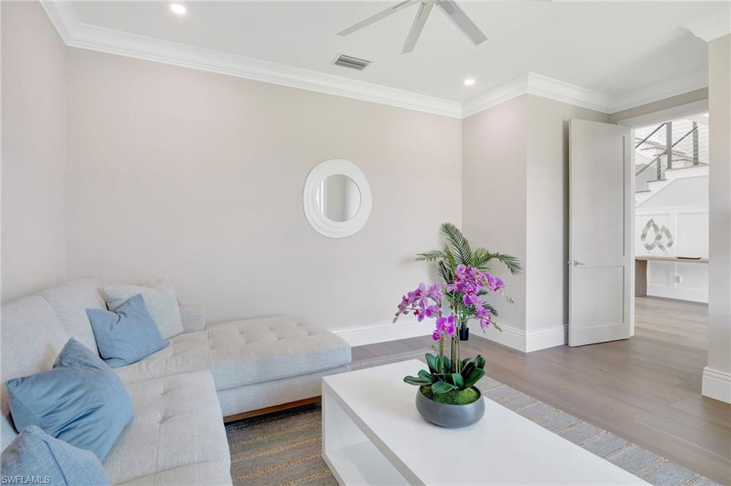 1308 Ridge Street Naples, FL 34103 - Photo 11 of 48 a living room with furniture and flowers