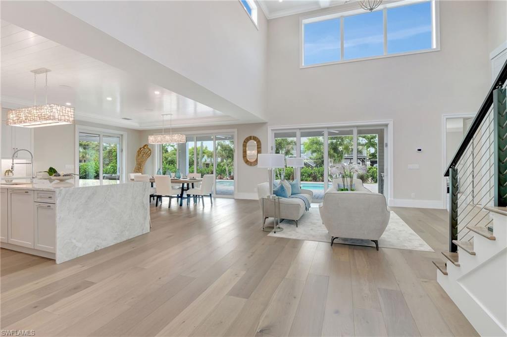1308 Ridge Street Naples, FL 34103 - Photo 13 of 48 a living room with furniture and a large window