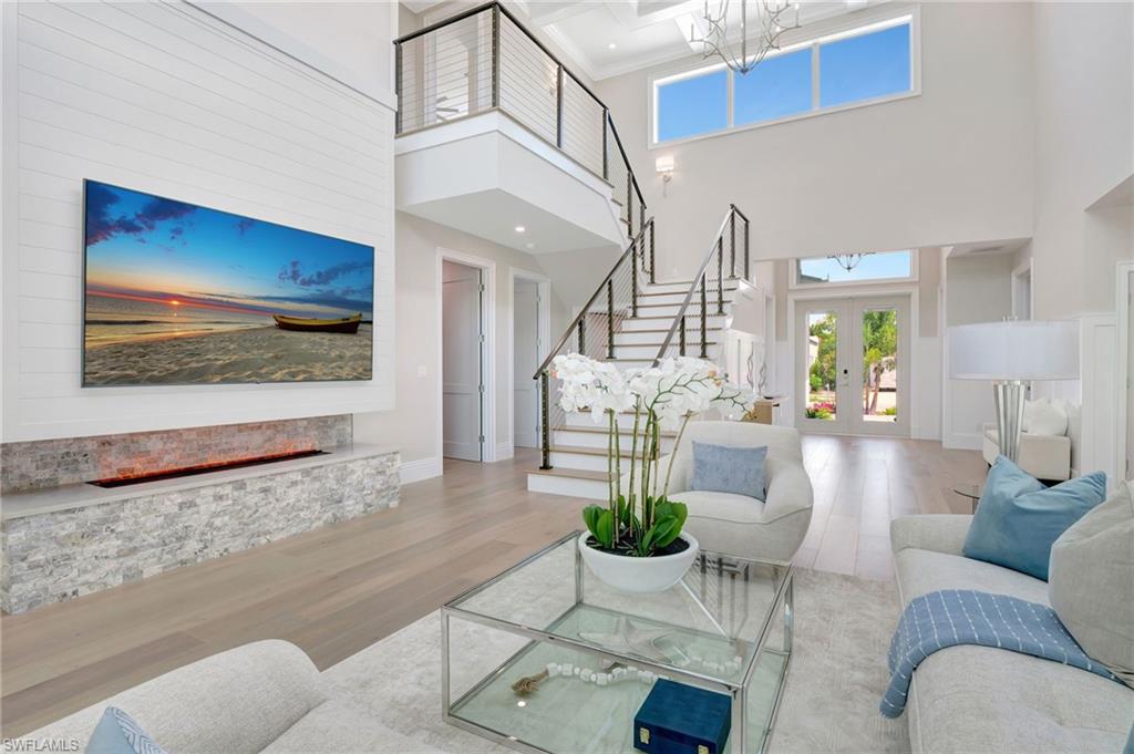 1308 Ridge Street Naples, FL 34103 - Photo 14 of 48 a living room with furniture and a flat screen tv