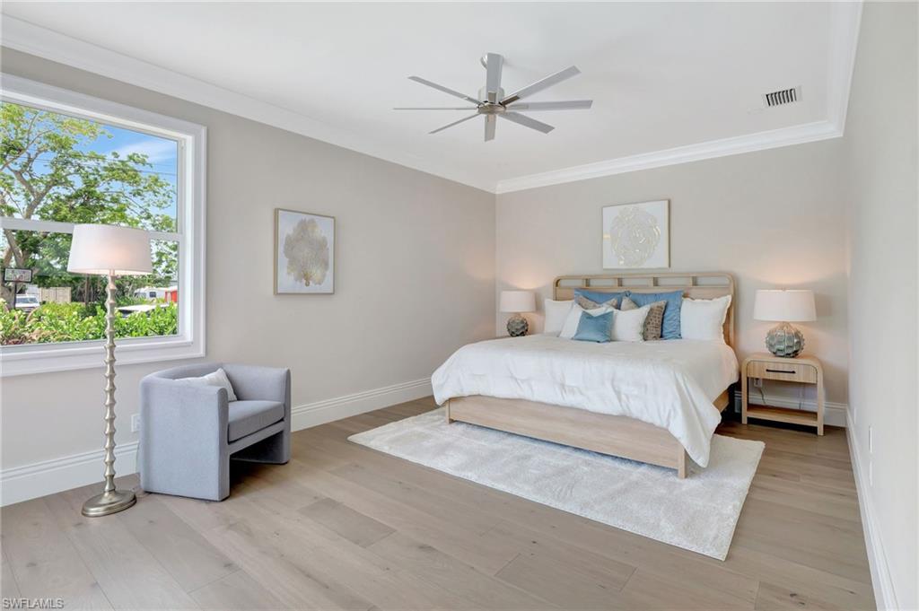 1308 Ridge Street Naples, FL 34103 - Photo 25 of 48 a bedroom with a bed and a large window
