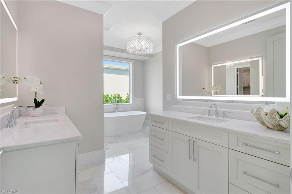 1308 Ridge Street Naples, FL 34103 - Photo 27 of 48 Dual Vanities with Quartzite Counters, Lighted Mirrors, Carrera Mable Floors