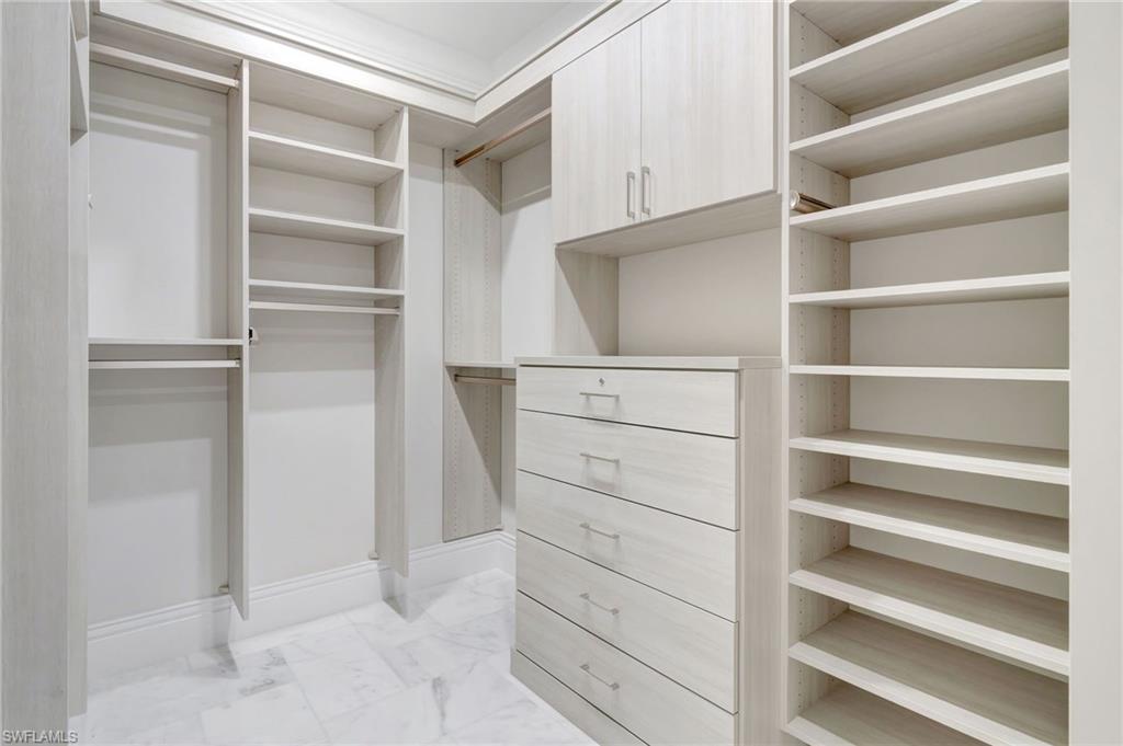 1308 Ridge Street Naples, FL 34103 - Photo 29 of 48 a view of walk in closet with empty racks