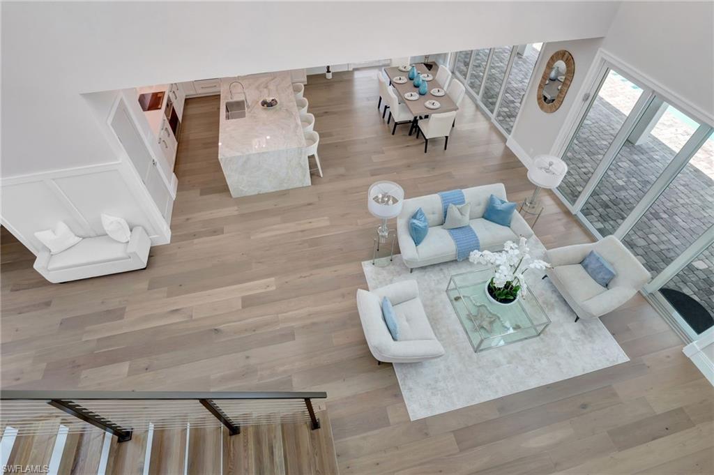 1308 Ridge Street Naples, FL 34103 - Photo 32 of 48 a living room with furniture and wooden floor