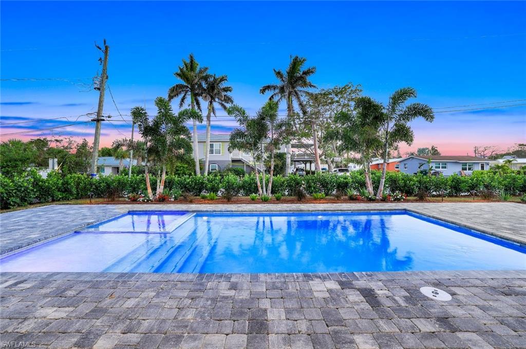 1308 Ridge Street Naples, FL 34103 - Photo 39 of 48 a view of swimming pool with a yard