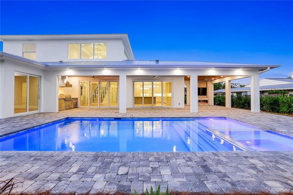 1308 Ridge Street Naples, FL 34103 - Photo 40 of 48 a view of a swimming pool with an outdoor space