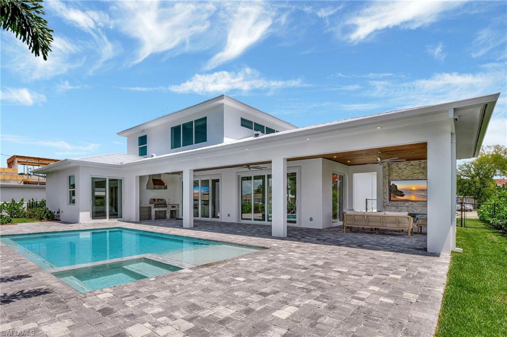 1308 Ridge Street Naples, FL 34103 - Photo 4 of 48 a view of house with swimming pool and porch