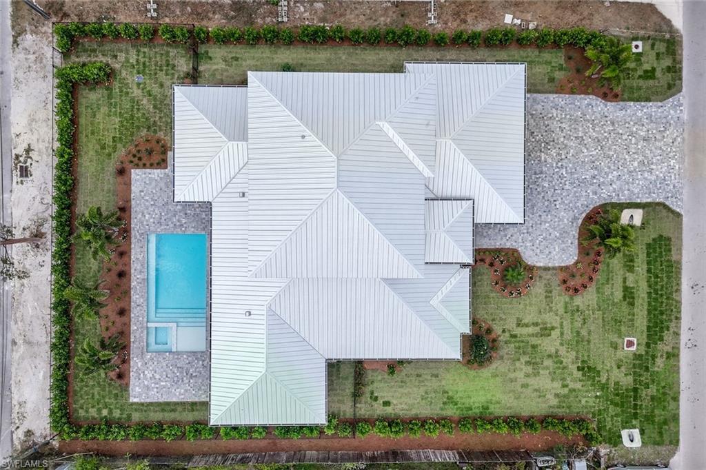 1308 Ridge Street Naples, FL 34103 - Photo 45 of 48 an aerial view of a house with a yard and lake view