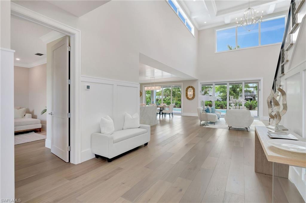 1308 Ridge Street Naples, FL 34103 - Photo 8 of 48 The Foyer Greets You With Soaring Coffered Ceilings and Natural Light