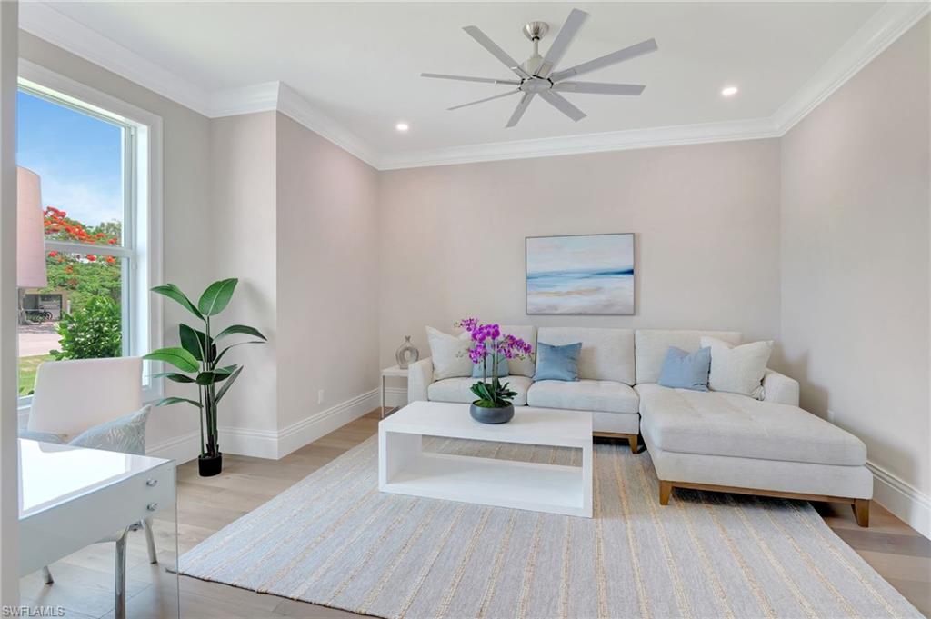 1308 Ridge Street Naples, FL 34103 - Photo 9 of 48 a living room with furniture flowerpot and a chandelier