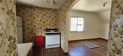 a kitchen with a sink stove and refrigerator