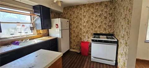 wooden floor with a bathroom