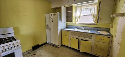 a kitchen with a stove top oven