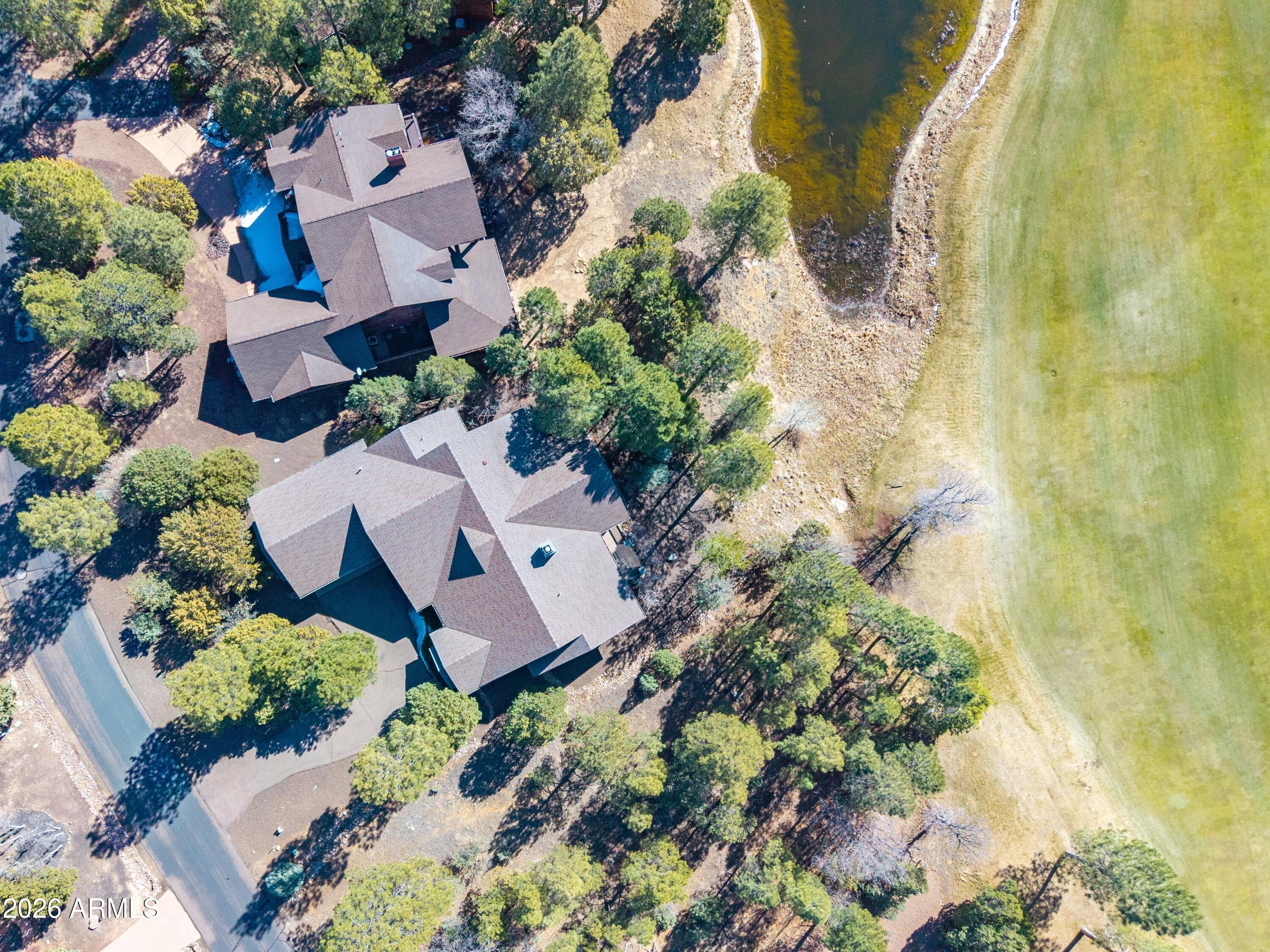 3990 Sugar Pine Loop Show Low, AZ 85901 - Photo 1 of 62 an aerial view of a house with a yard and garden