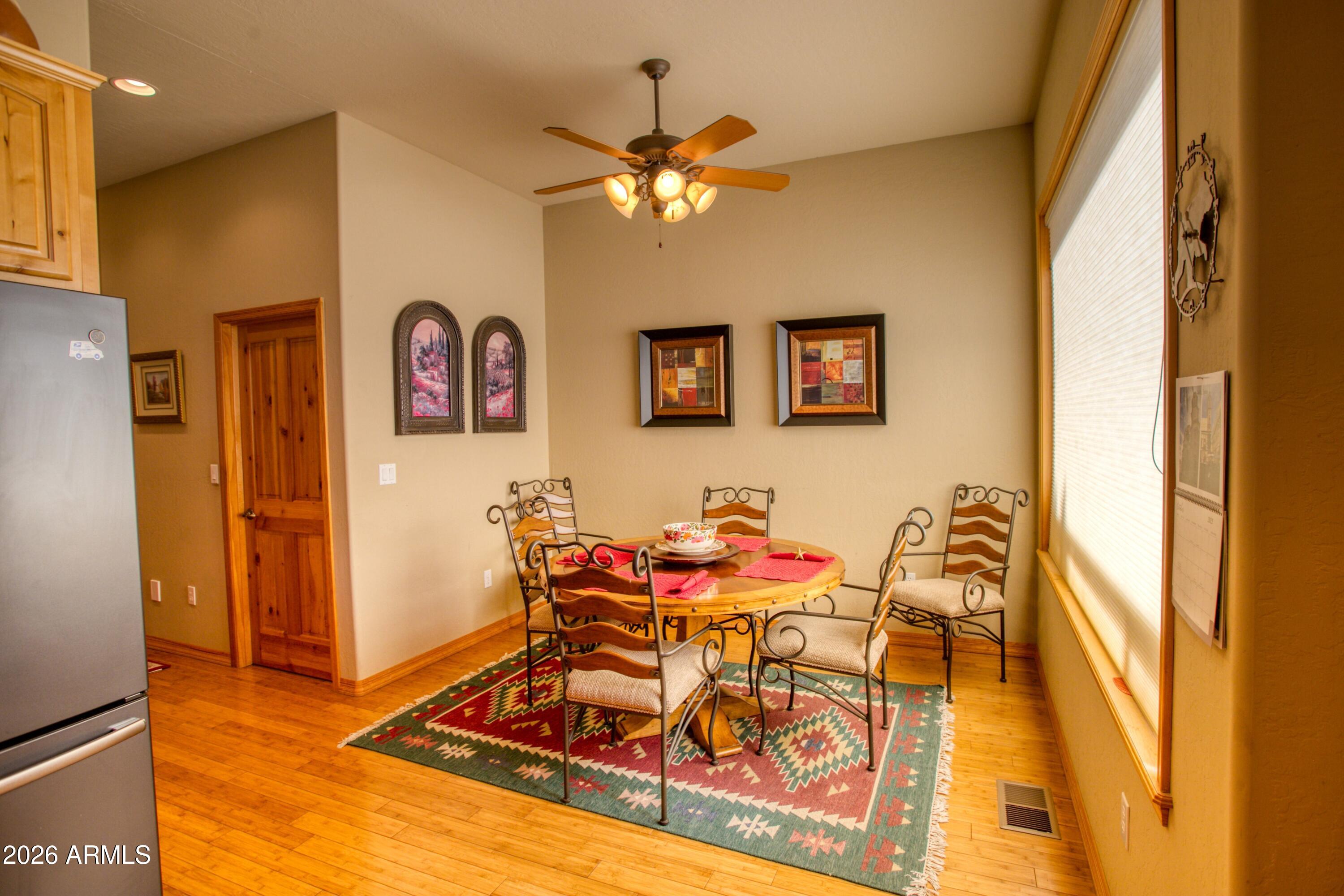 3990 Sugar Pine Loop Show Low, AZ 85901 - Photo 9 of 62 a living room with furniture and a chandelier