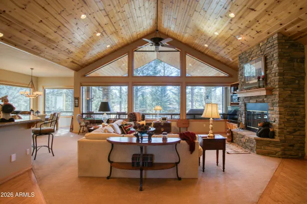 a living room with lots of furniture and a chandelier